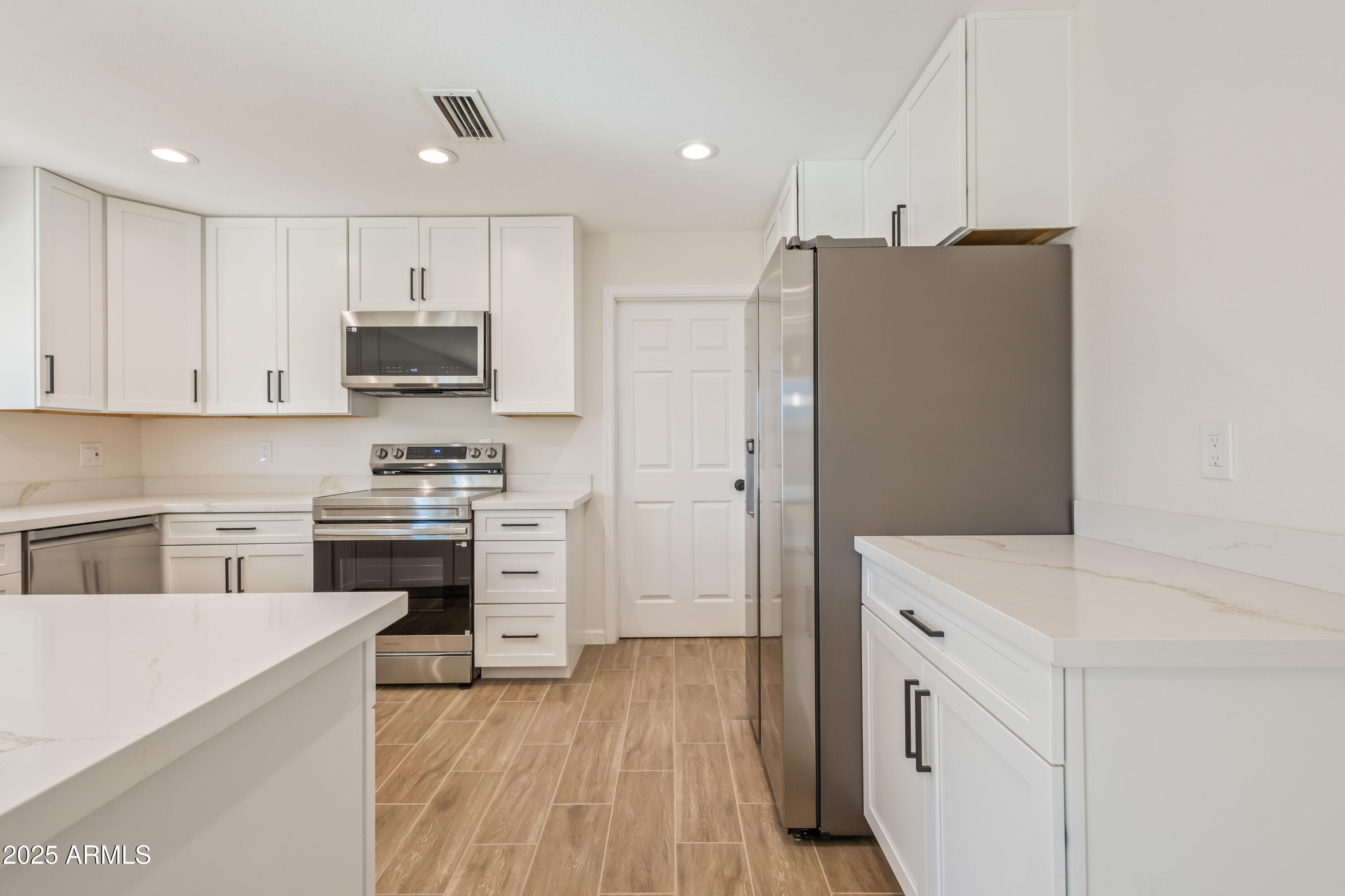 1022 South Allen Mesa, AZ 85204 - Photo 12 of 38 a kitchen with stainless steel appliances a refrigerator stove and sink