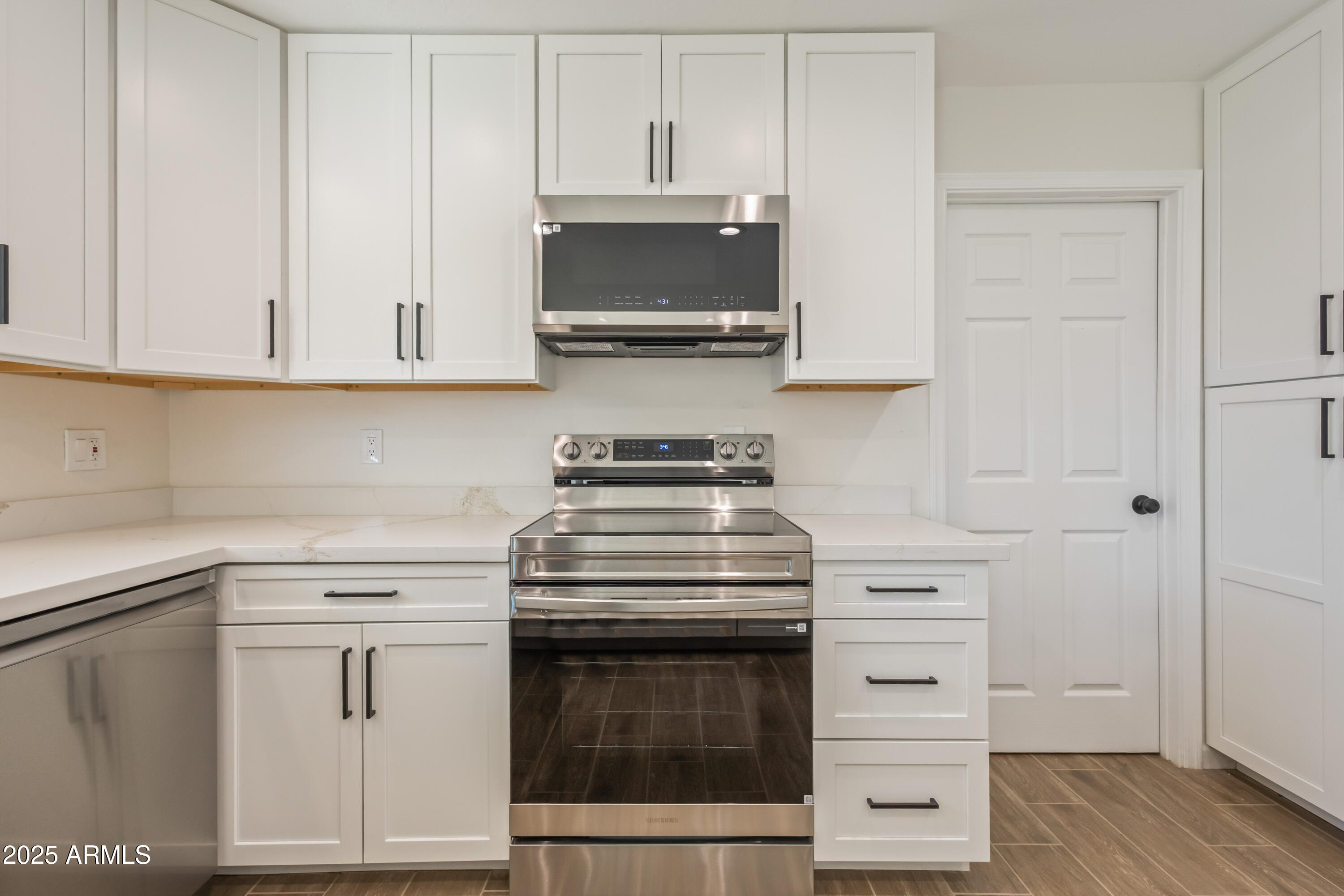 1022 South Allen Mesa, AZ 85204 - Photo 14 of 38 a kitchen with white cabinets and appliances