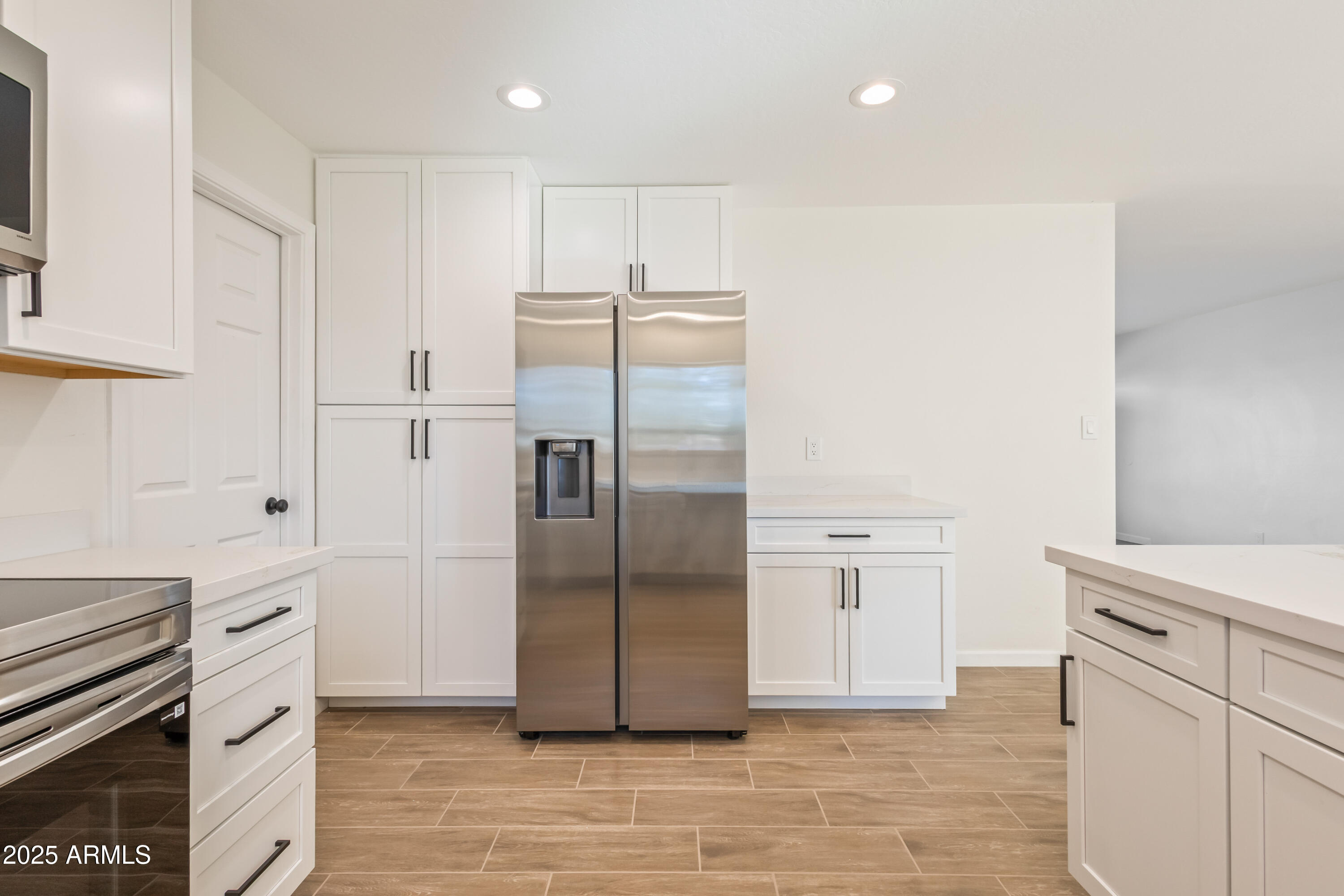 1022 South Allen Mesa, AZ 85204 - Photo 15 of 38 a kitchen with granite countertop a refrigerator and a stove