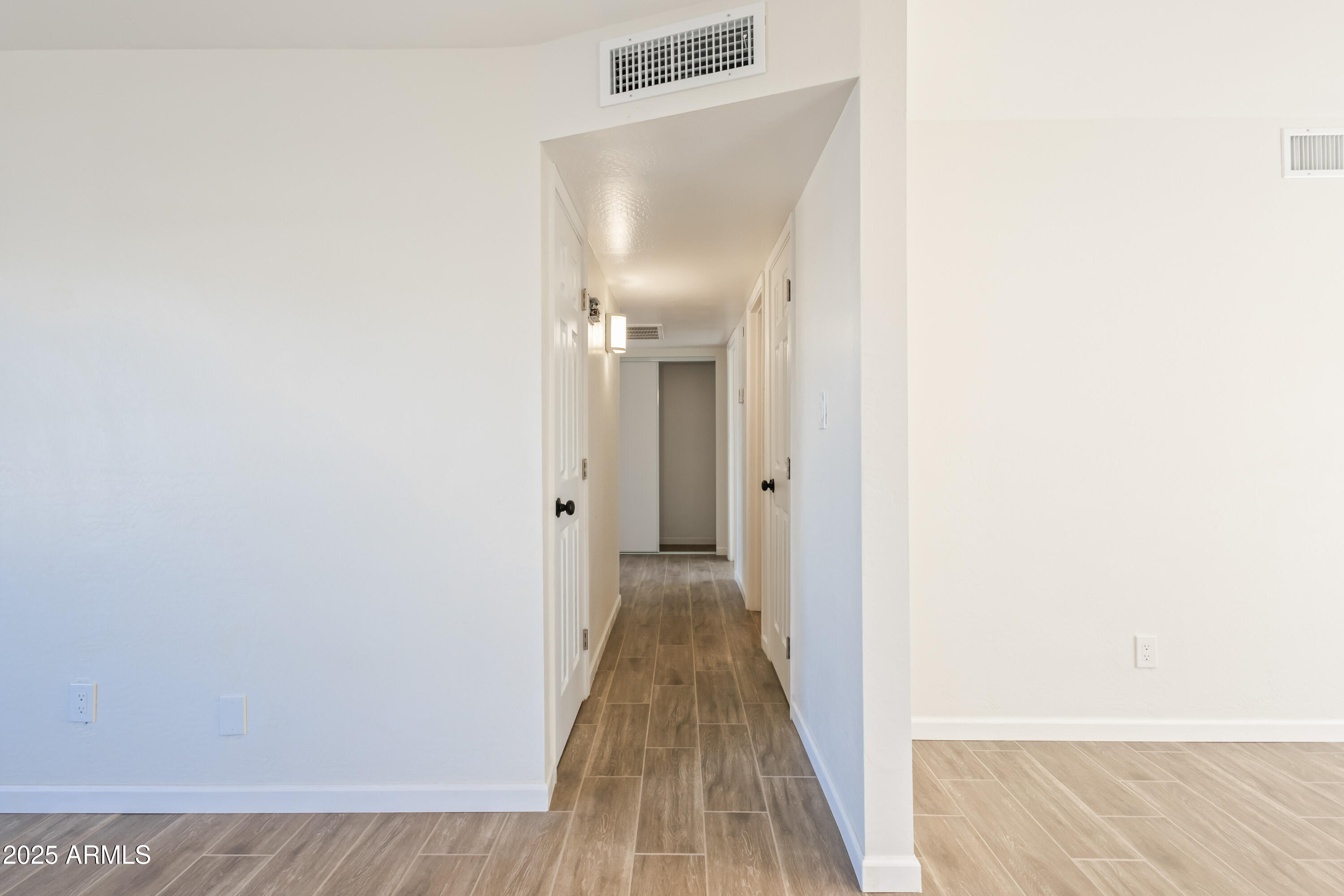 1022 South Allen Mesa, AZ 85204 - Photo 16 of 38 a view of a hallway with wooden floor