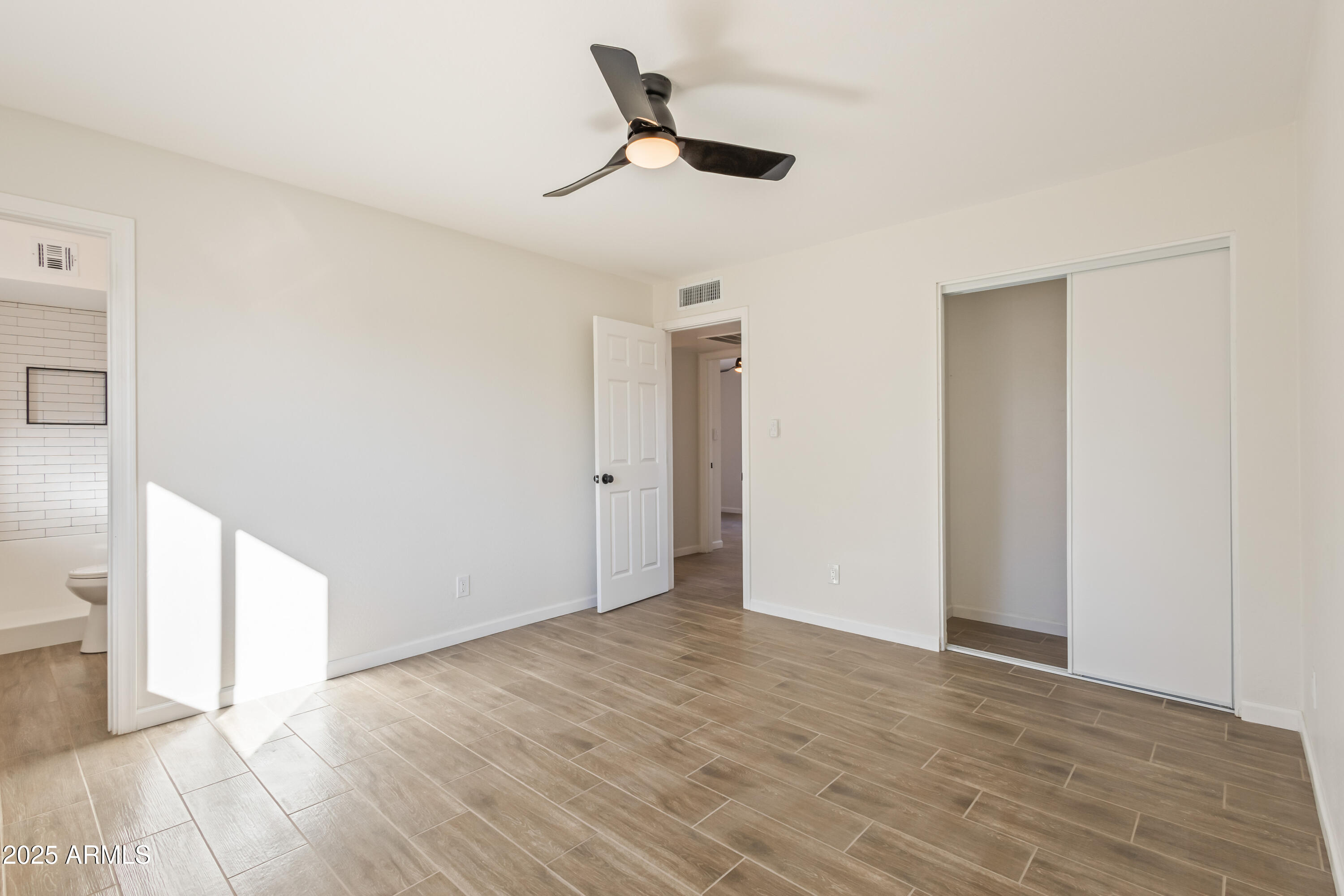 1022 South Allen Mesa, AZ 85204 - Photo 18 of 38 a view of an empty room with wooden floor