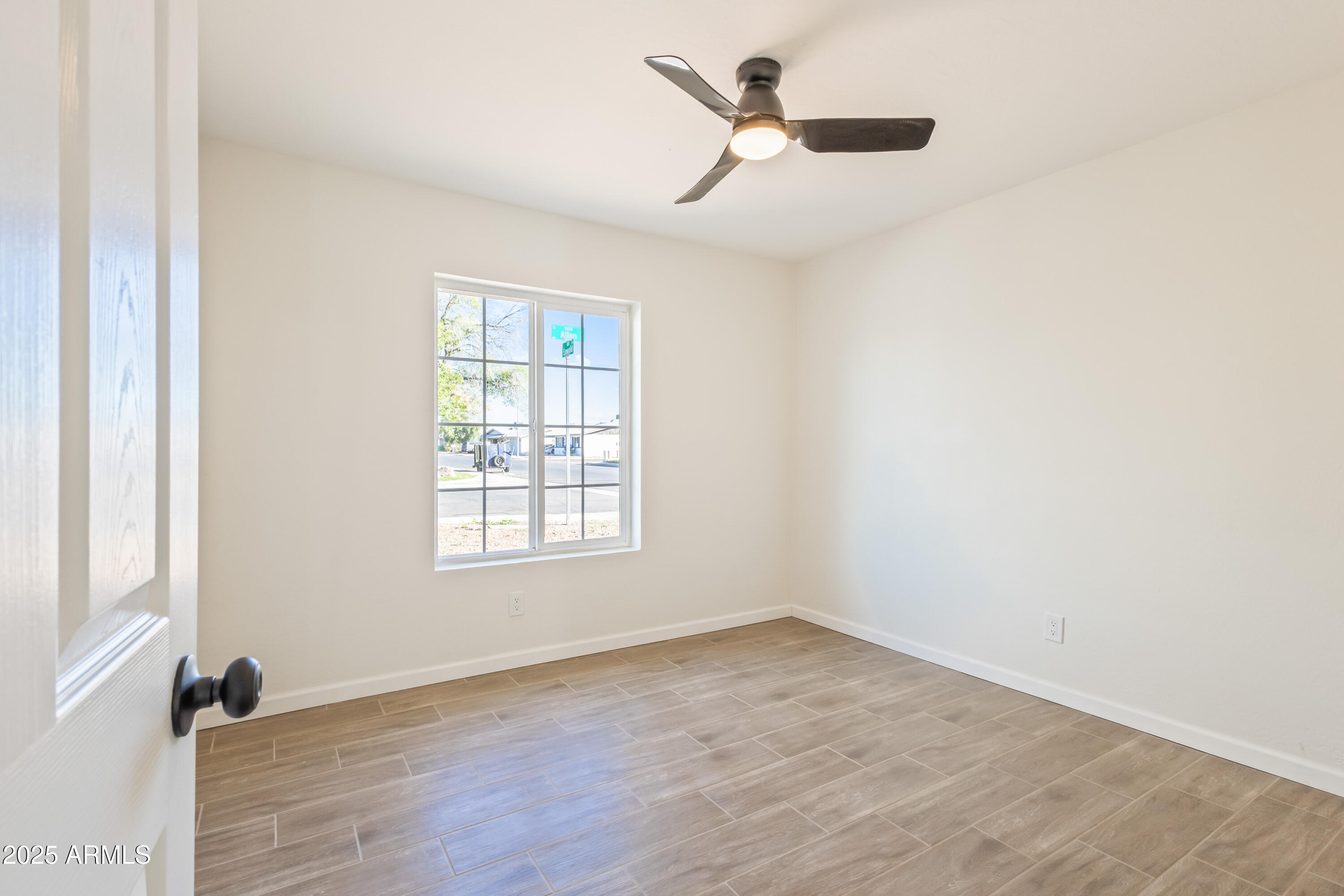 1022 South Allen Mesa, AZ 85204 - Photo 23 of 38 wooden floor in an empty room with a window