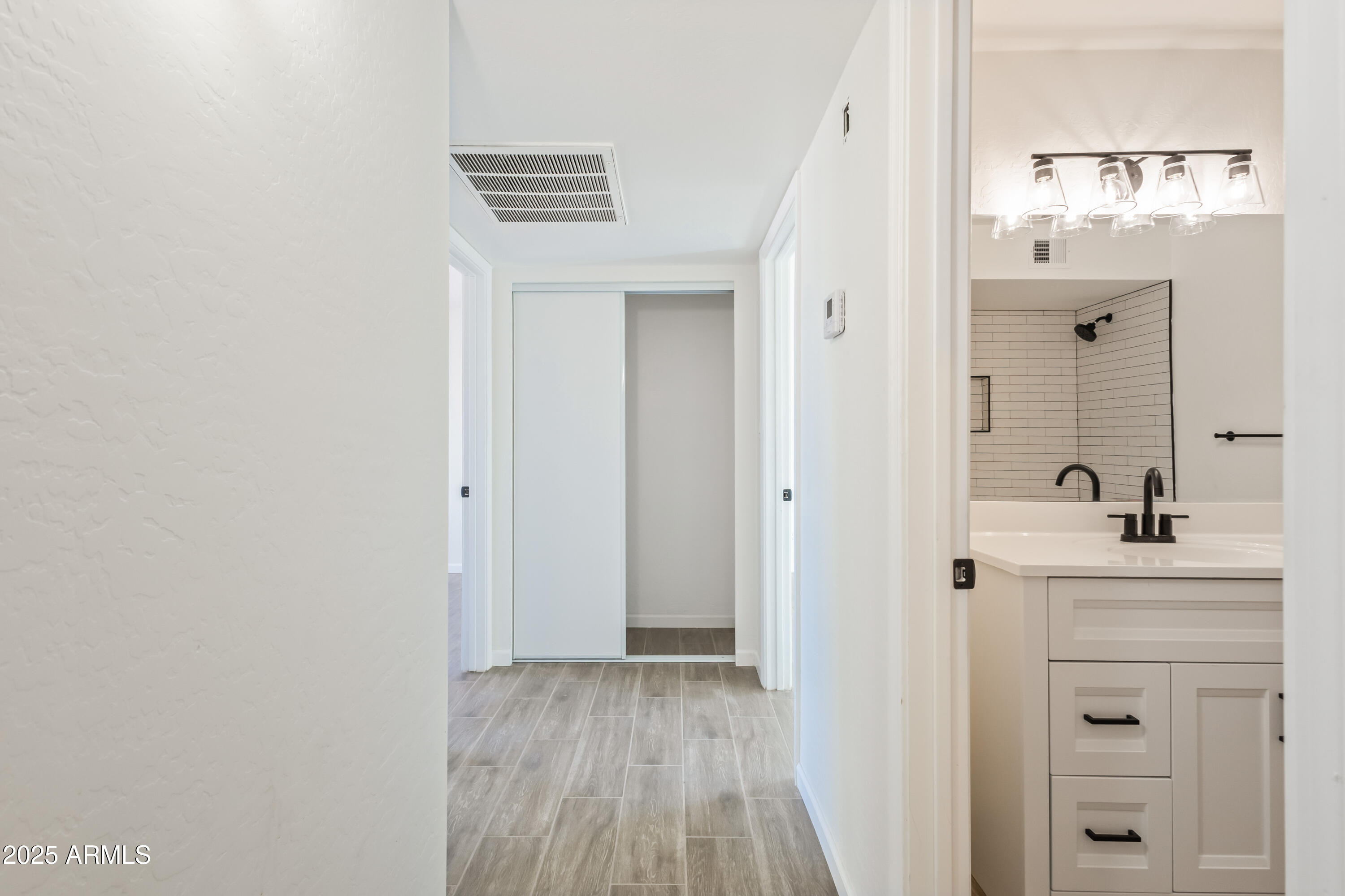 1022 South Allen Mesa, AZ 85204 - Photo 27 of 38 a bathroom with a sink a mirror and a shower