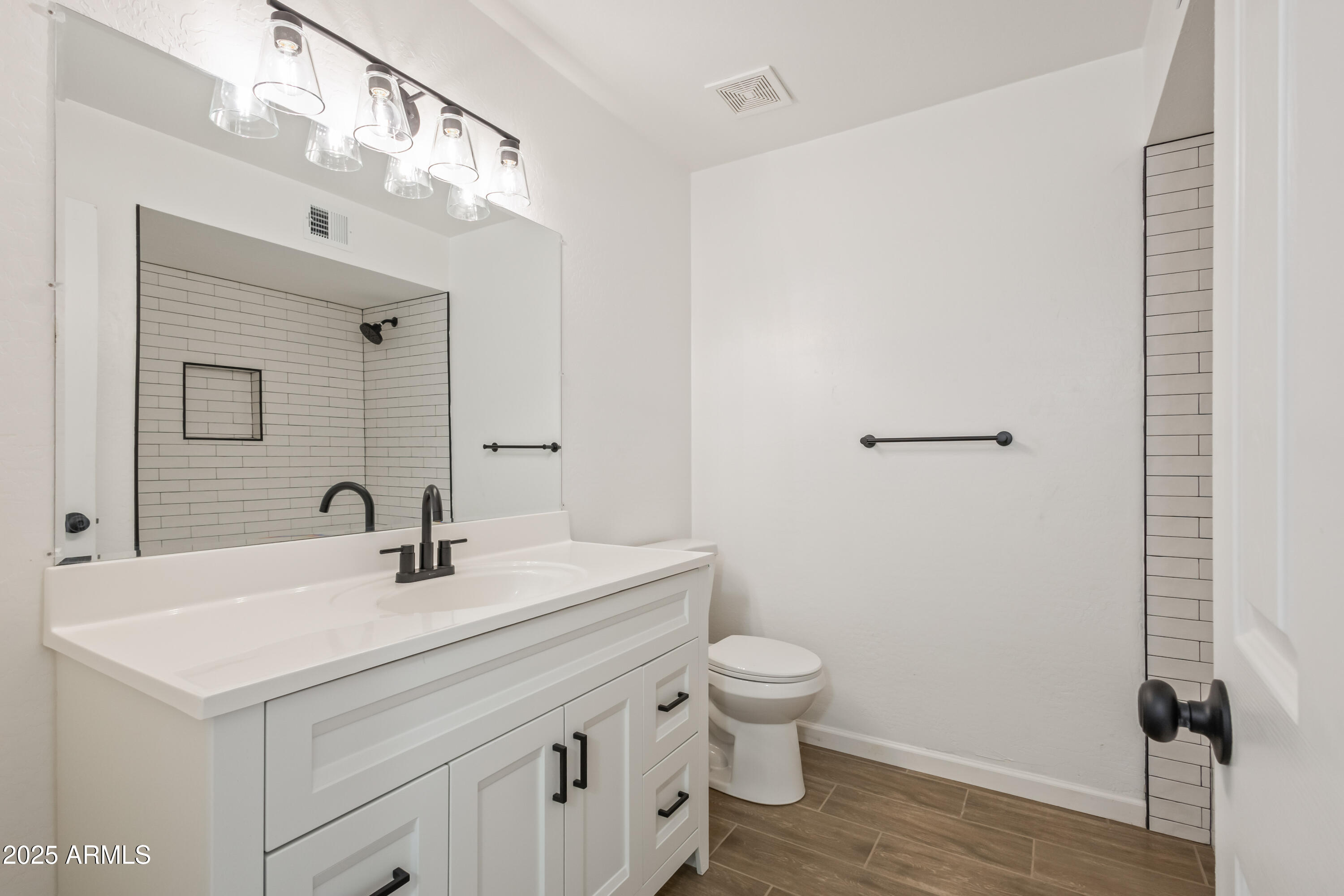 1022 South Allen Mesa, AZ 85204 - Photo 28 of 38 a bathroom with a sink toilet and vanity