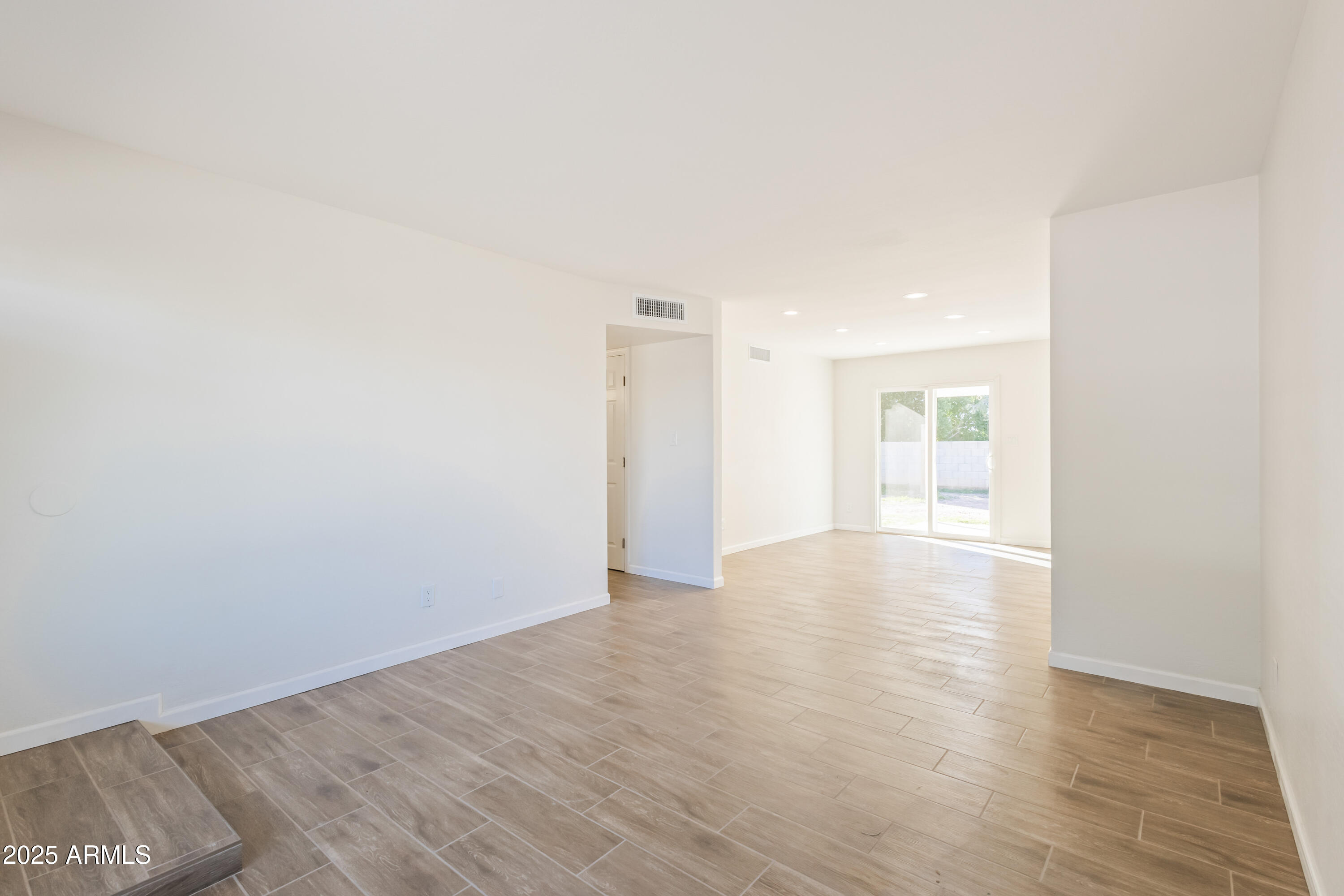 1022 South Allen Mesa, AZ 85204 - Photo 9 of 38 a view of an empty room with wooden floor