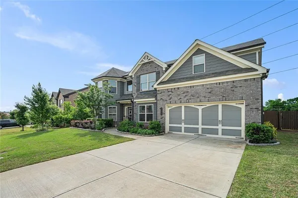 front view of a house with a yard