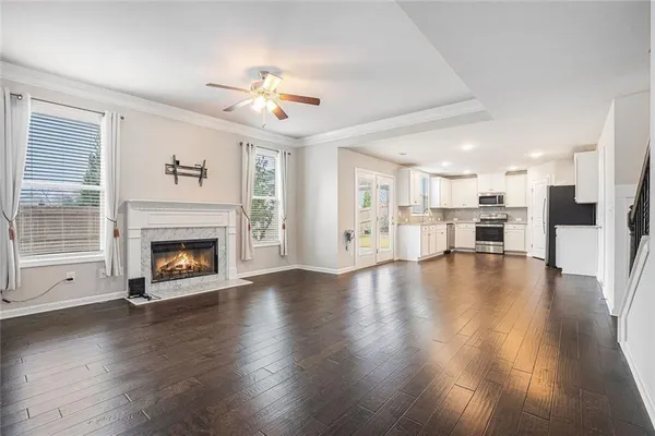 a living room with furniture fireplace and flat screen tv