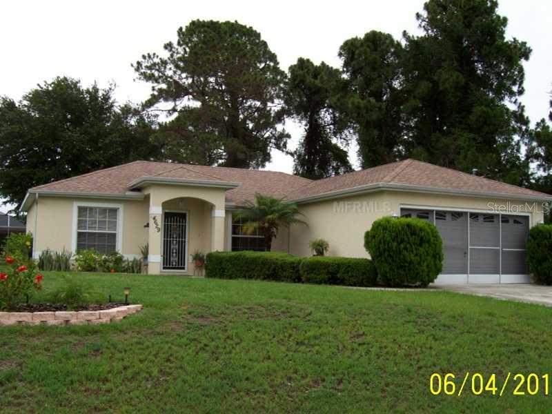 4629 Oakley Road North Port, FL 34288 - Photo 1 of 1 a front view of a house with a garden