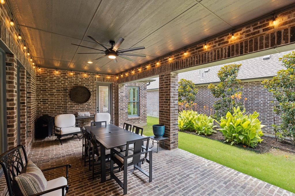 12444 Riverhill Road Frisco, TX 75033 - Photo 35 of 37 View of terrace, brick patio with ceiling fan, string lights, access to family room and master bedroom.