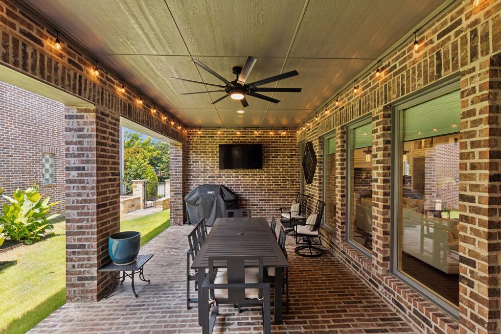 12444 Riverhill Road Frisco, TX 75033 - Photo 36 of 37 View of patio featuring ceiling fan, gas for grilling, and electric for TV mount.