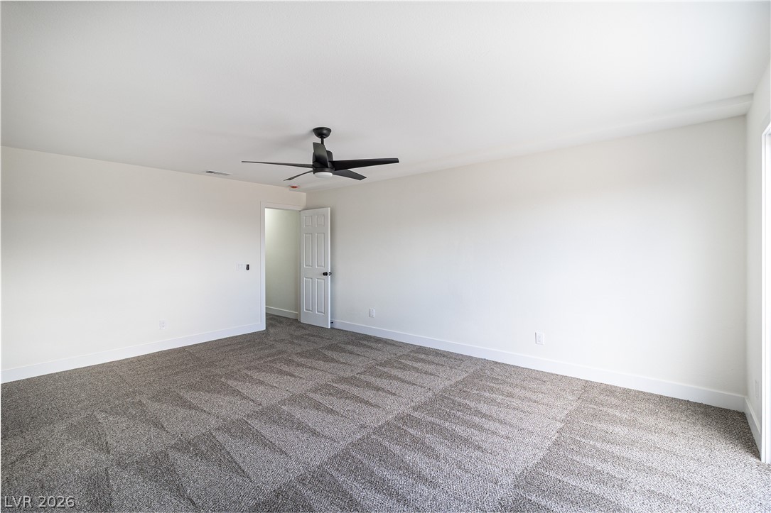 1891 Brian Road Pahrump, NV 89048 - Photo 36 of 50 Spare room featuring visible vents, baseboards, carpet floors, and ceiling fan