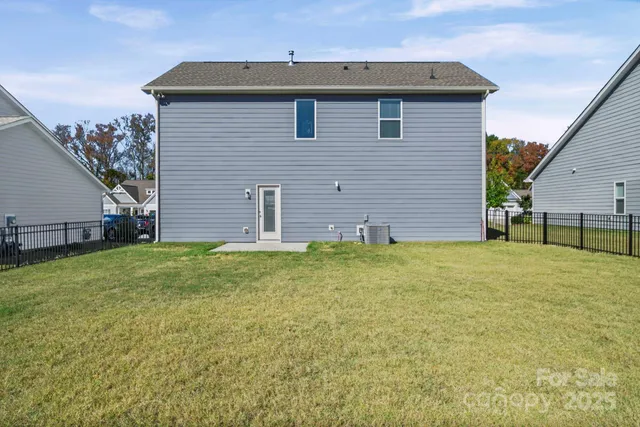 a view of a backyard of the house