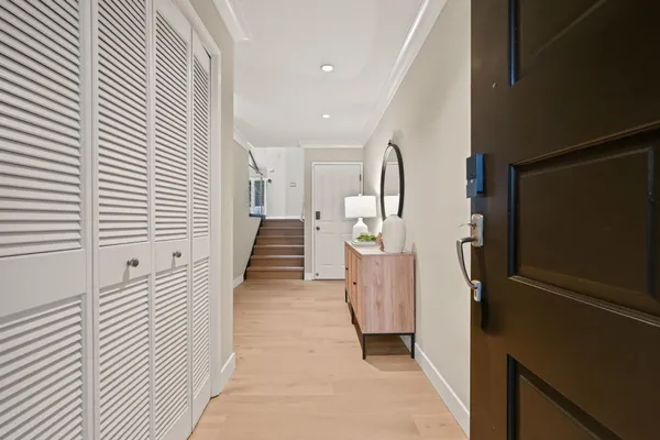 a view of a hallway with stairs