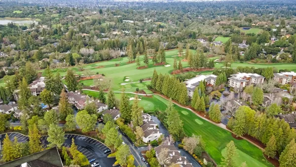 an aerial view of a house with a outdoor space