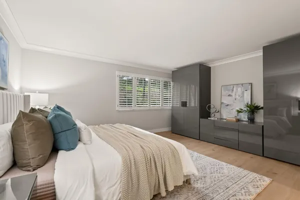a bedroom with a bed and a couch