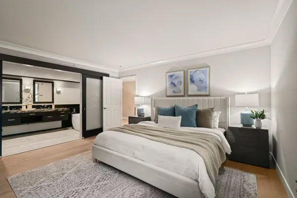 a bedroom with a large bed and a couch