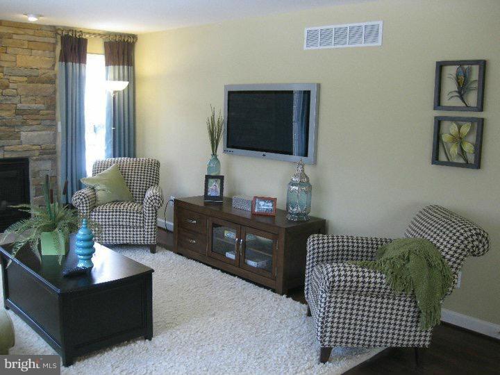 Rock Spring Forest Hill, MD 21050 - Photo 2 of 22 a living room with furniture and a flat screen tv