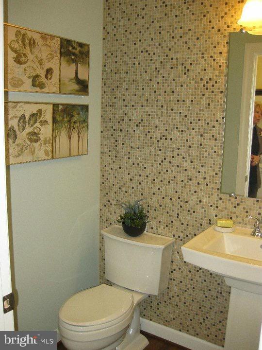 Rock Spring Forest Hill, MD 21050 - Photo 11 of 22 a white toilet sitting next to a bathroom sink