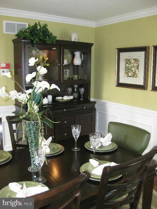 Rock Spring Forest Hill, MD 21050 - Photo 7 of 22 a dining room with furniture a kitchen view and wooden floor