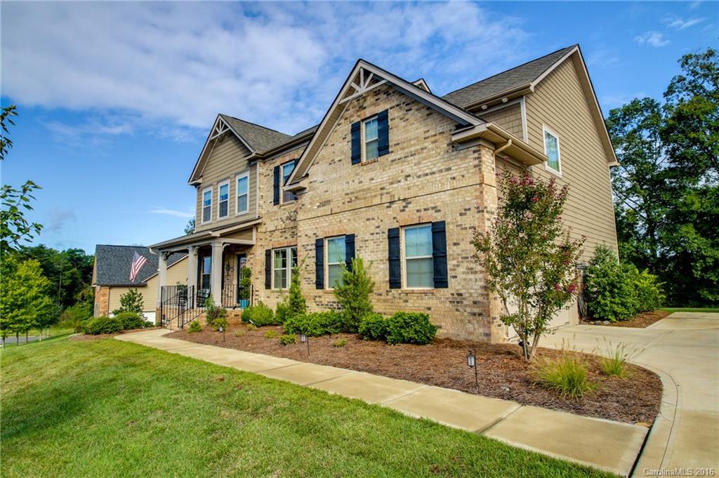662 Reliance Court, Unit 13 Tega Cay, SC 29708 - Photo 2 of 24 a front view of a house with a yard and trees
