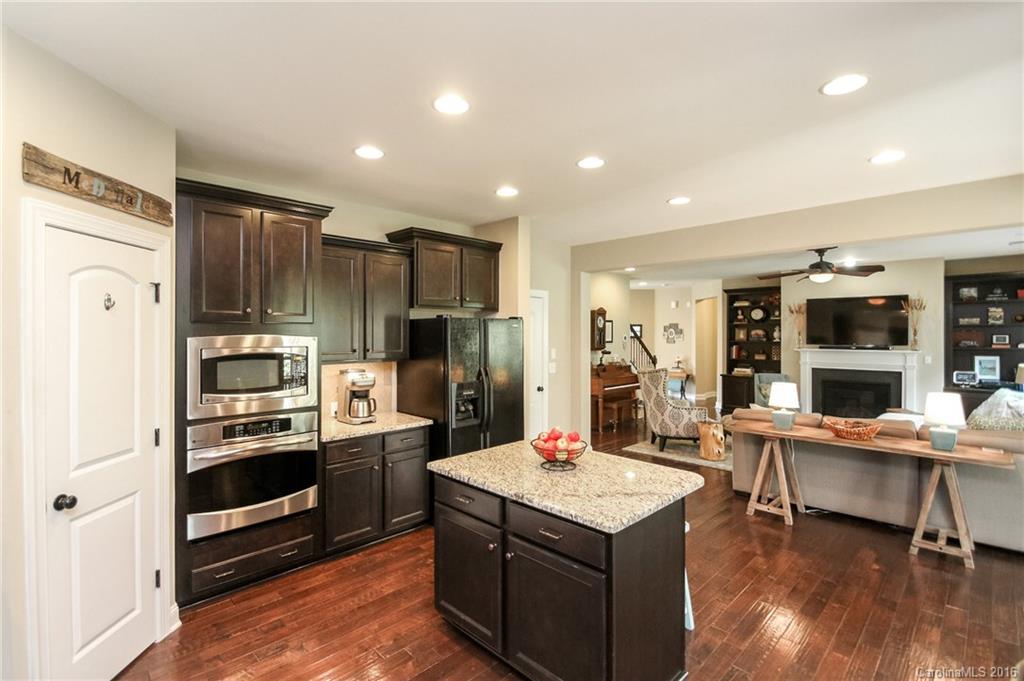 662 Reliance Court, Unit 13 Tega Cay, SC 29708 - Photo 12 of 24 a kitchen that has a lot of cabinets and stainless steel appliances