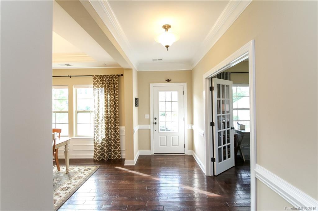 662 Reliance Court, Unit 13 Tega Cay, SC 29708 - Photo 3 of 24 a view of entryway with wooden floor and stairs