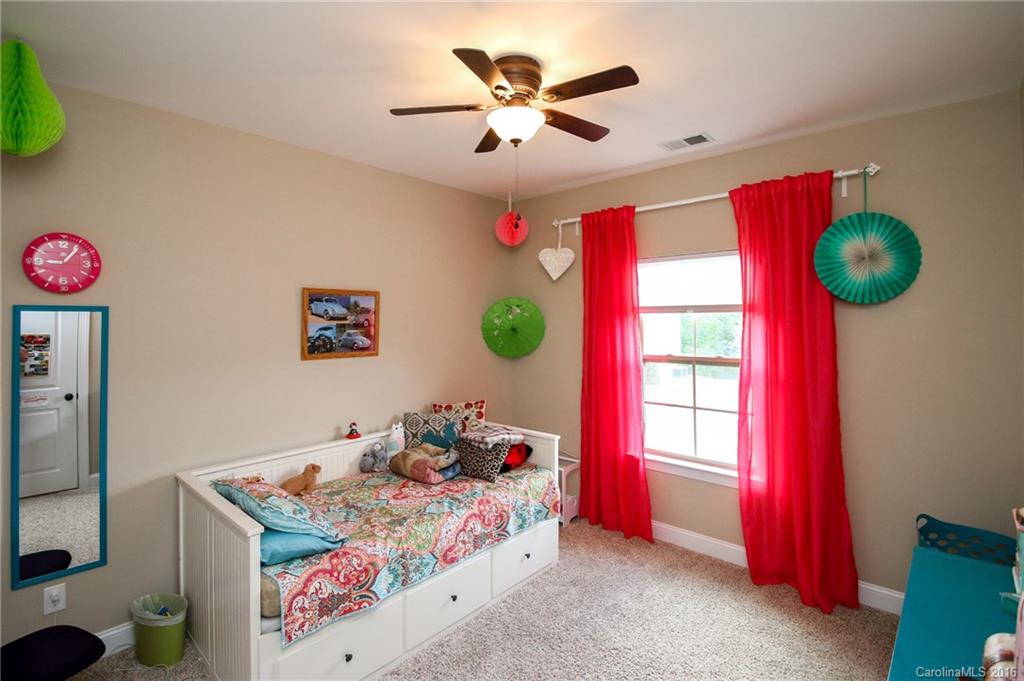 662 Reliance Court, Unit 13 Tega Cay, SC 29708 - Photo 22 of 24 a bedroom with a bed and window