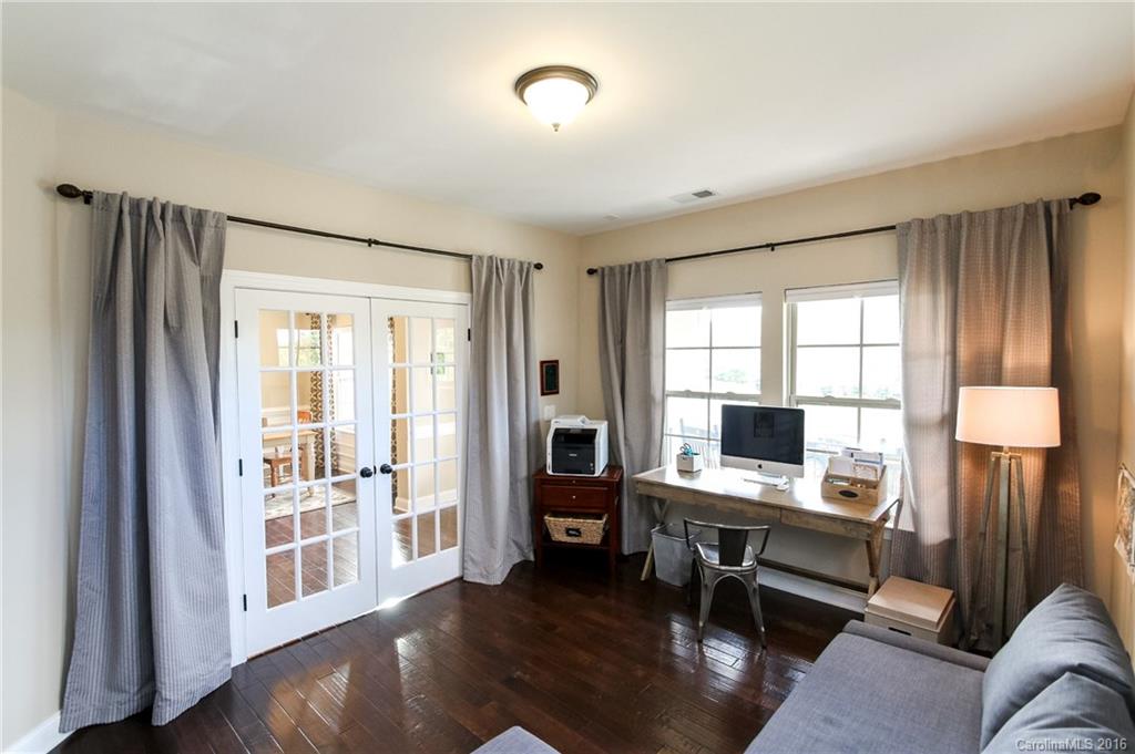 662 Reliance Court, Unit 13 Tega Cay, SC 29708 - Photo 7 of 24 a view of a livingroom with workspace and a window