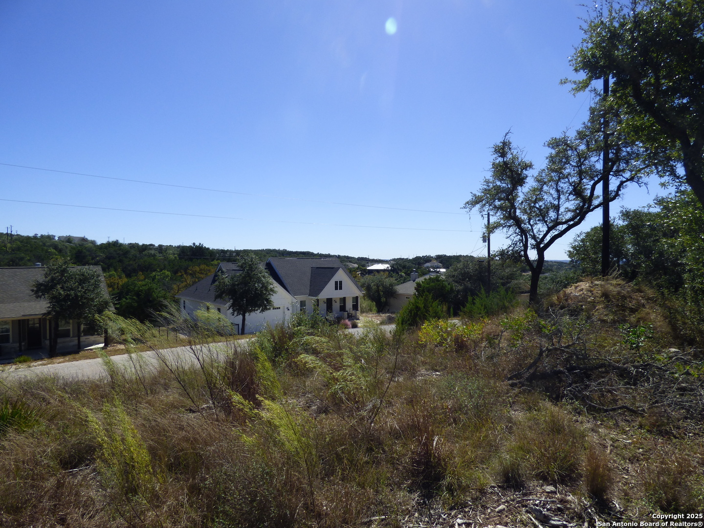 198 Magnolia Meadow Spring Branch, TX 78070 - Photo 6 of 10 a view of a lake with lots of trees