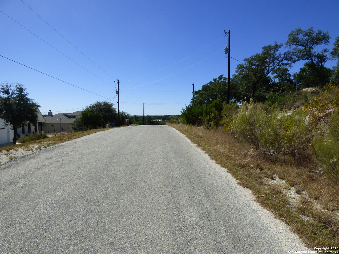 198 Magnolia Meadow Spring Branch, TX 78070 - Photo 10 of 10 a view of a road with a building in the background