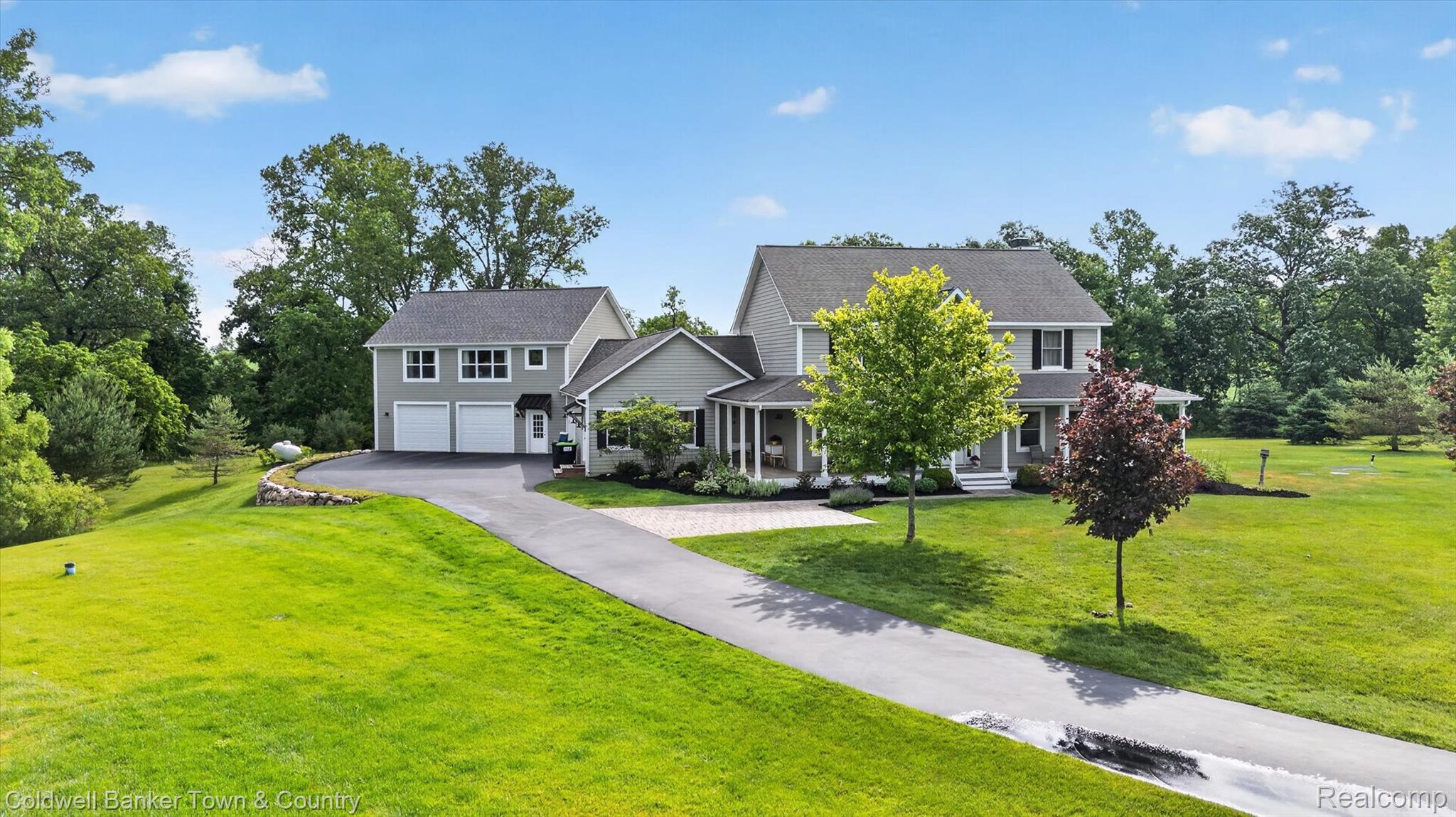 918 Gray Fox Court Howell, MI 48843 - Photo 69 of 84 Two-story residence with light gray siding and a dark gray shingled roof