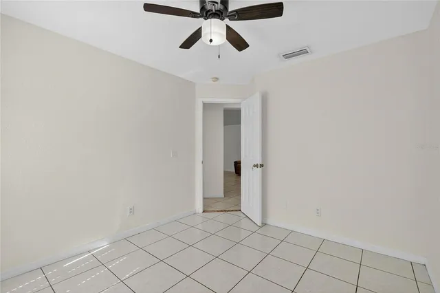a bathroom with a granite countertop toilet and a shower