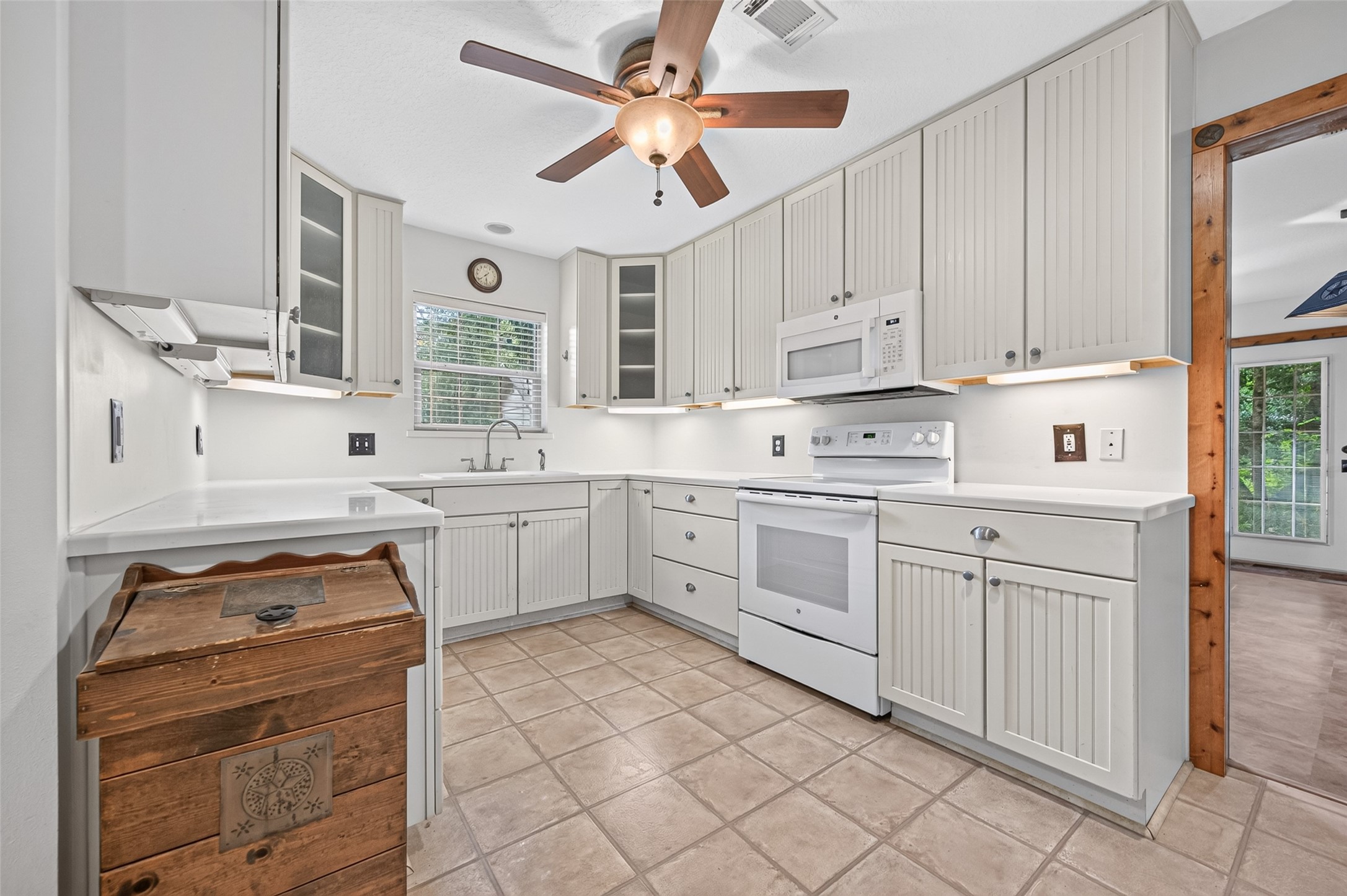 13996 Kidd Road Conroe, TX 77302 - Photo 12 of 46 Kitchen offering lots of cabinetry, storage and under counter lighting