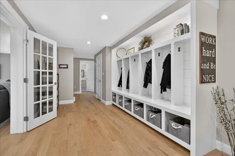 a view of an entryway with wooden floor