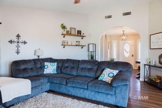 308 North Nolan Street Ridgecrest, CA 93555 - Photo 8 of 35 a living room with furniture and a mirror