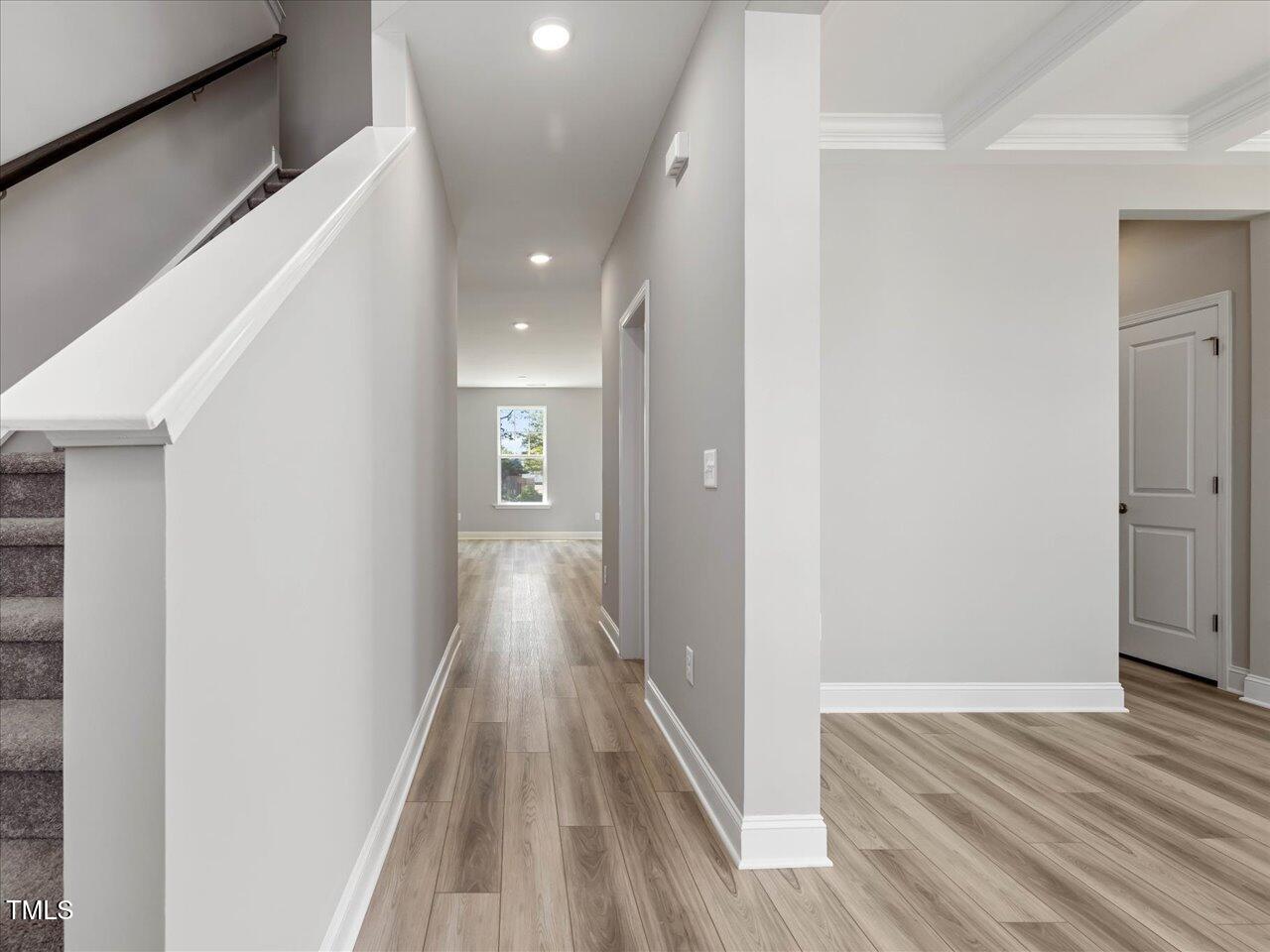 63 Biscayne Court Angier, NC 27501 - Photo 13 of 52 a view of a hallway with wooden floor