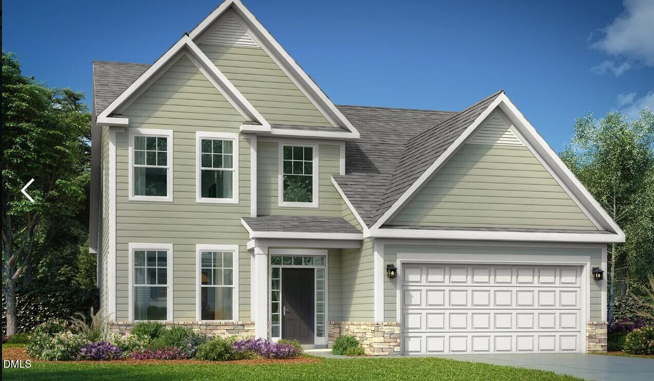 63 Biscayne Court Angier, NC 27501 - Photo 2 of 52 a front view of a house with garden