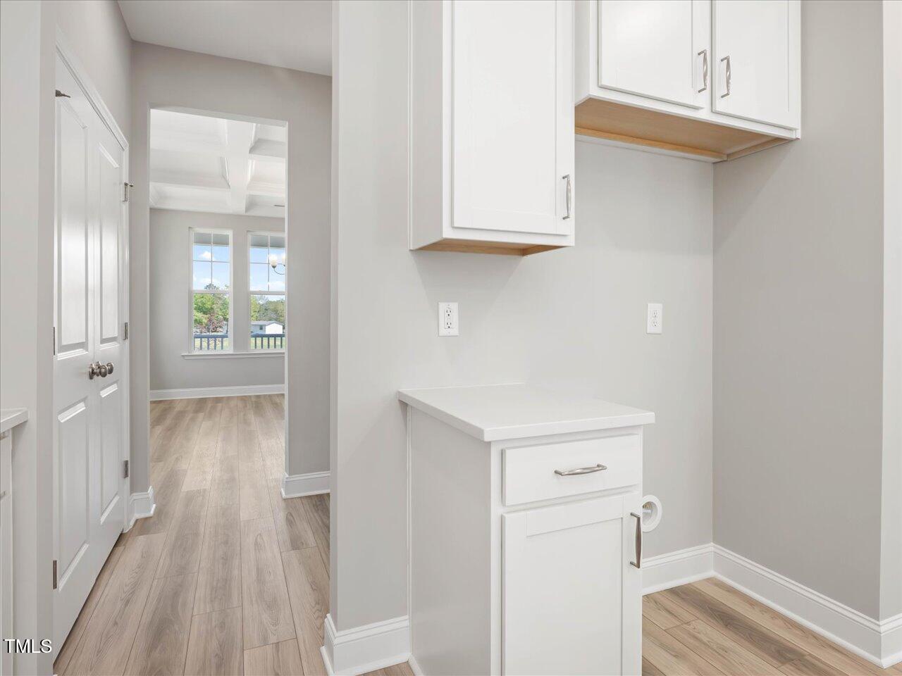 63 Biscayne Court Angier, NC 27501 - Photo 23 of 52 a view of a hallway with wooden floor and closet