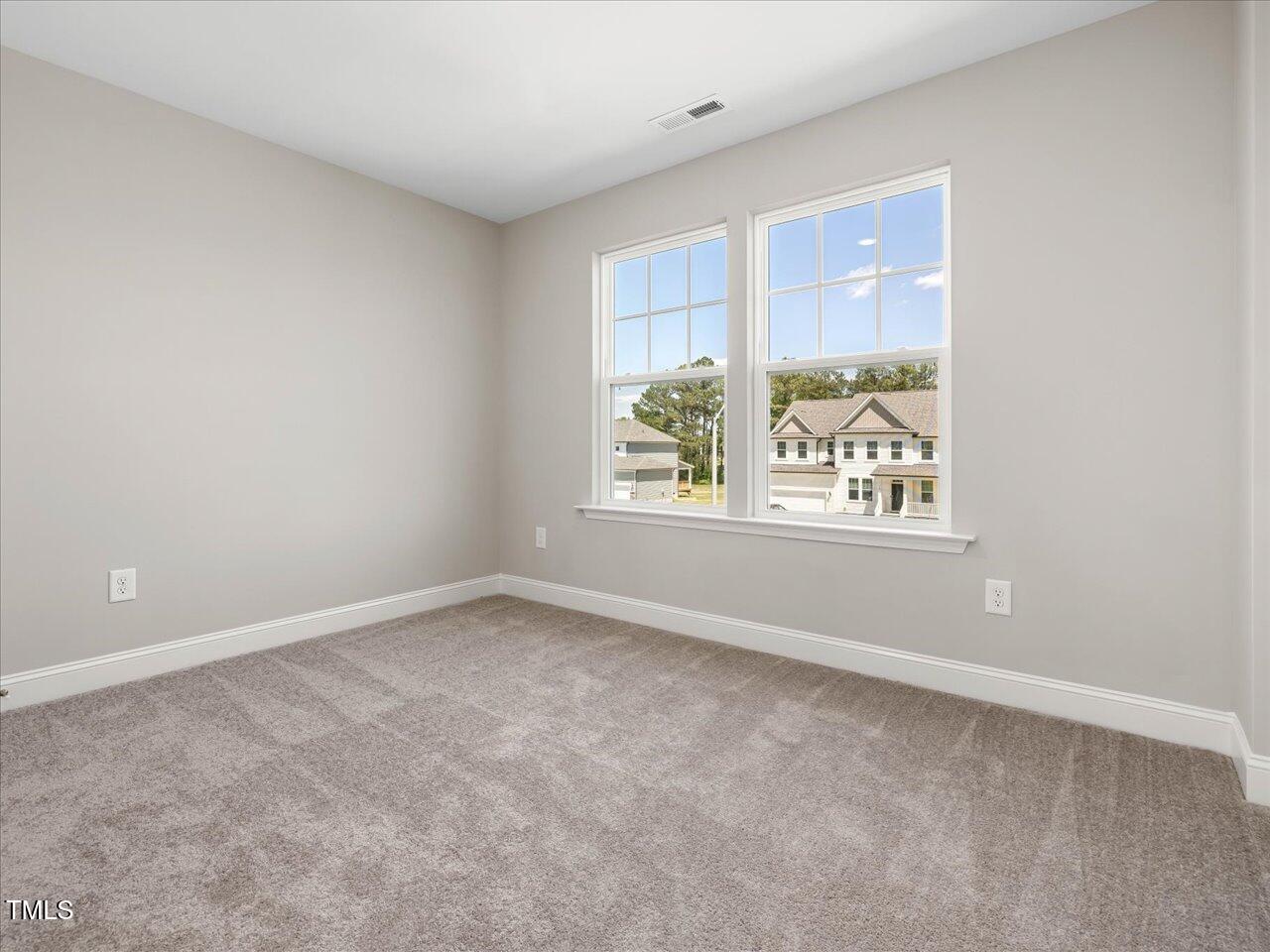63 Biscayne Court Angier, NC 27501 - Photo 42 of 52 an empty room with windows