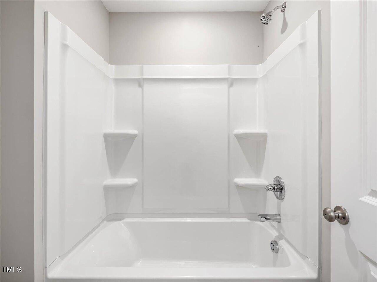 63 Biscayne Court Angier, NC 27501 - Photo 48 of 52 a bathroom with a bathtub