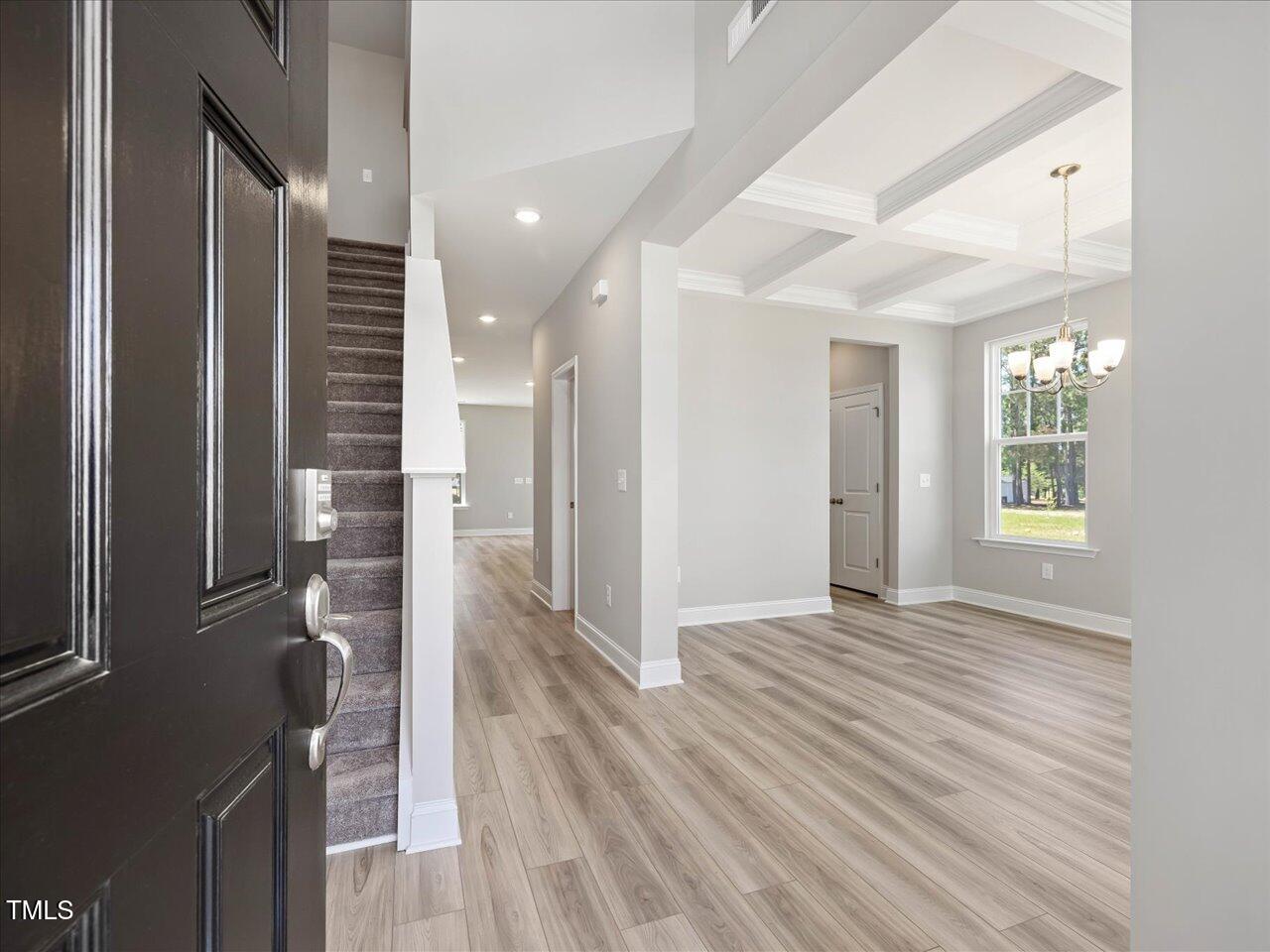 63 Biscayne Court Angier, NC 27501 - Photo 7 of 52 a view of livingroom with hardwood floor and a window