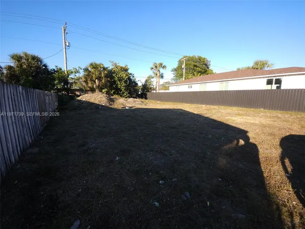 a view of a ocean next to a yard