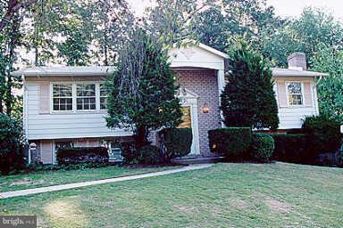 13021 Tamarack Road Silver Spring, MD 20904 - Photo 1 of 1 a front view of a house with a garden