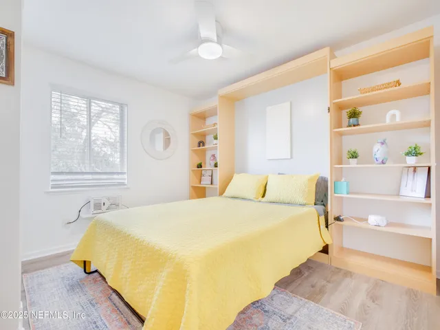 a bedroom with a bed and a cabinets