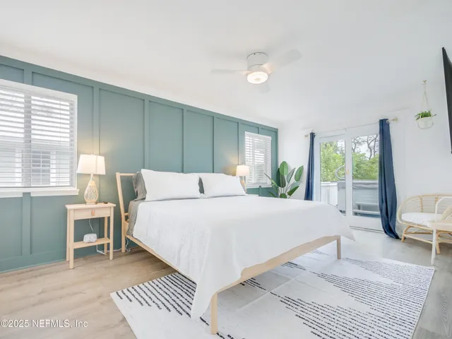 a bedroom with a large bed and a window