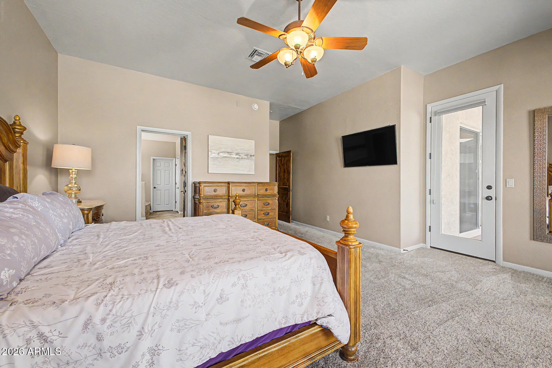 27909 North Quail Spring Road Rio Verde, AZ 85263 - Photo 17 of 52 a bedroom with a bed and a flat tv screen on the dresser