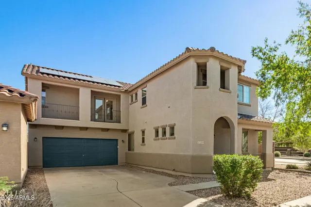 a front view of a house with a garage