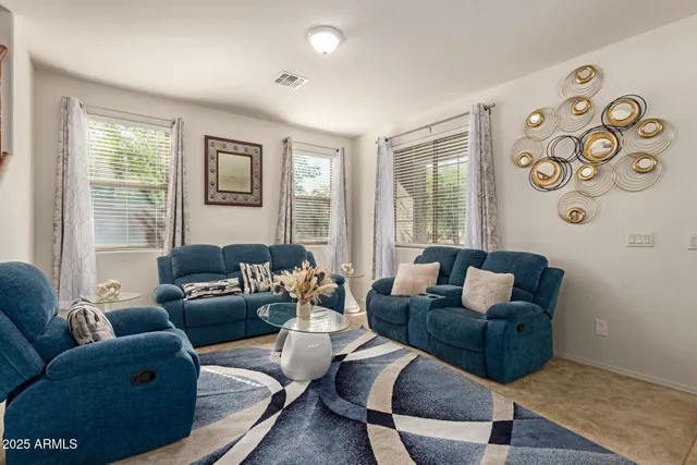 a living room with furniture and a window