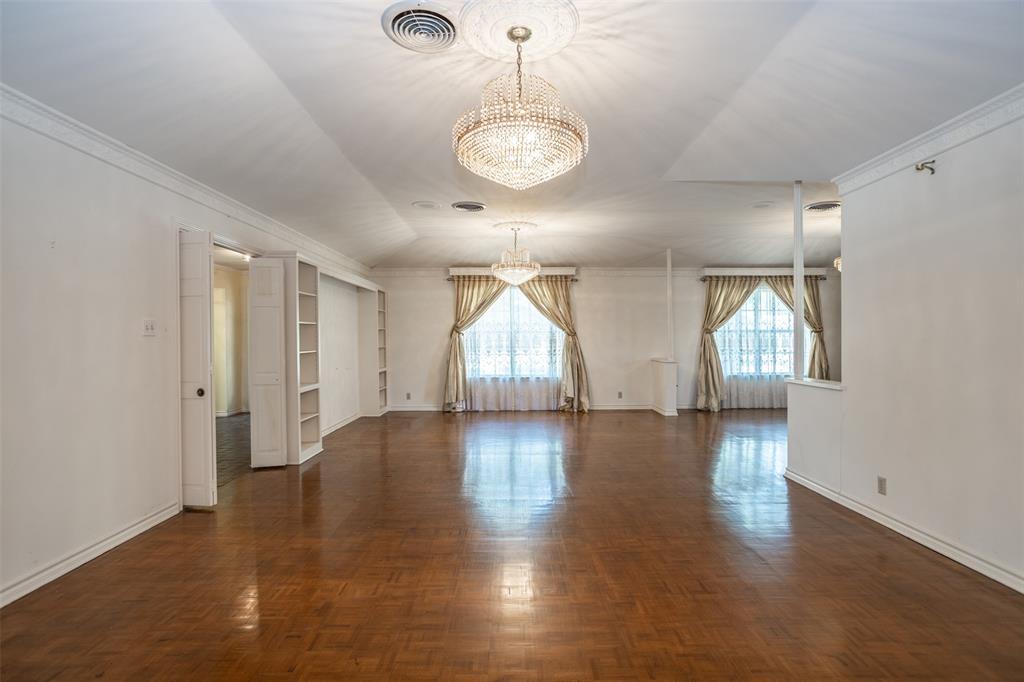 1010 Aspen Road Gainesville, TX 76240 - Photo 18 of 40 a view of an empty room with window and wooden floor