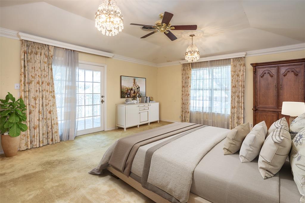 1010 Aspen Road Gainesville, TX 76240 - Photo 33 of 40 a spacious bedroom with a bed and a chandelier